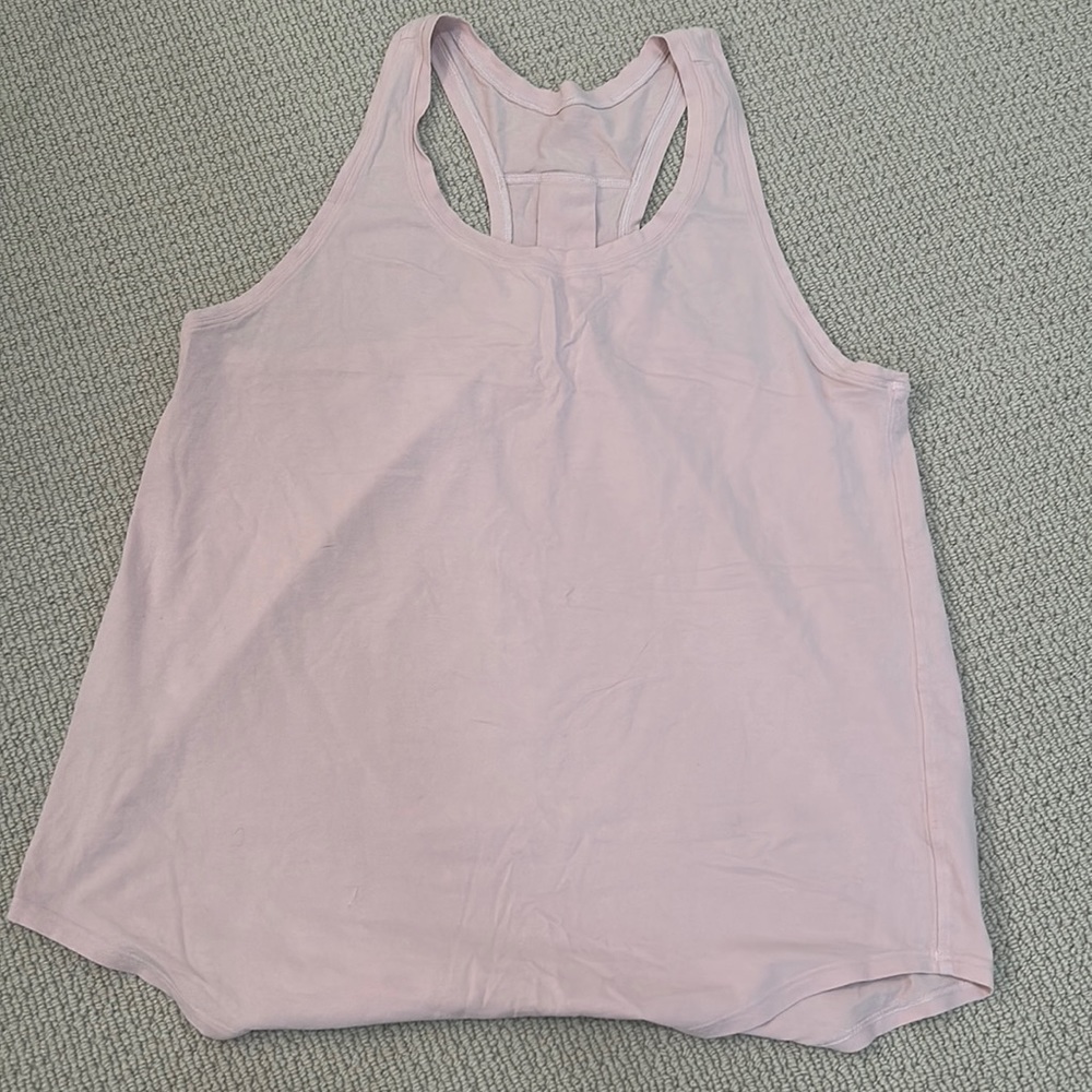 Light pinkish purple workout tank with detail on the back. Tag has fallen off